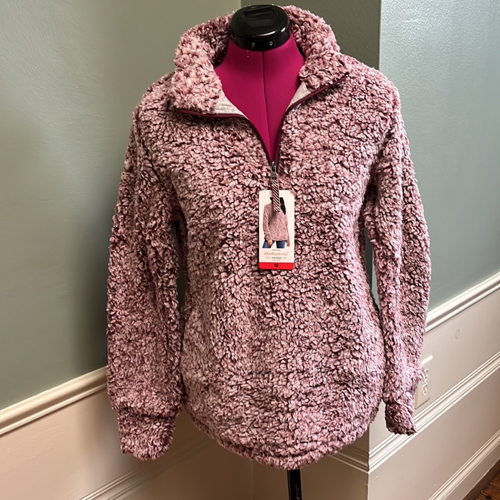 Never worn NWT 1/4 zip size medium fully lined fleece pullover.